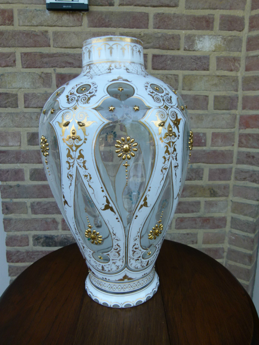 A white and gold Bohemian vase.