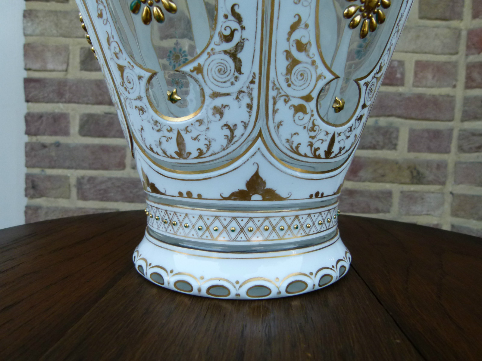 A white and gold Bohemian vase.