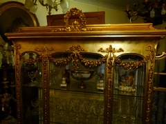 Louis 16 style display cabinet in gilded wood and plaster, France 1880