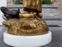 A young lady feeding chicks style Sculpture with ivory by Henryk II Kossowski in gilded and patinated bronze with ivory, Poland 1900