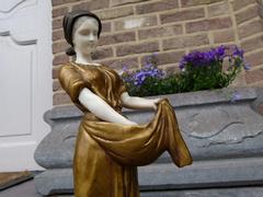 A young lady feeding chicks style Sculpture with ivory by Henryk II Kossowski in gilded and patinated bronze with ivory, Poland 1900