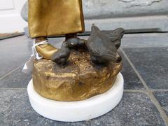 A young lady feeding chicks style Sculpture with ivory by Henryk II Kossowski in gilded and patinated bronze with ivory, Poland 1900