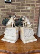 Alabaster book stands with dogs