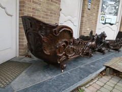 Barock style A sleigh transformed to a pair flower pots with dogs in carved wood, probably Germany 1770