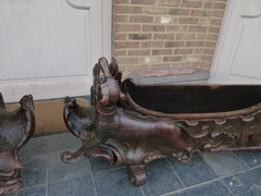 Barock style A sleigh transformed to a pair flower pots with dogs in carved wood, probably Germany 1770