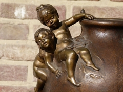 Belle epoque style bronze vase with putto,s on red marble base in patinated bronze, France 1890