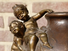 Belle epoque style bronze vase with putto,s on red marble base in patinated bronze, France 1890