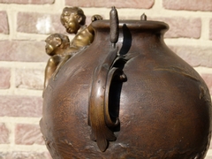 Belle epoque style bronze vase with putto,s on red marble base in patinated bronze, France 1890