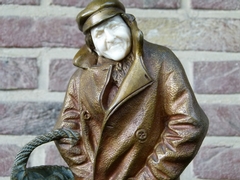 Belle epoque style Sculpture by H. Sécarel of a man with ivory face in multi color patinated bronze, France 1900