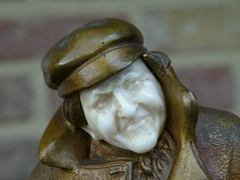 Belle epoque style Sculpture by H. Sécarel of a man with ivory face in multi color patinated bronze, France 1900