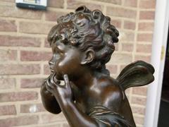 Belle epoque, style Sculpture of a putto in patinated bronze, France 1880,unsigned probaply Moreau