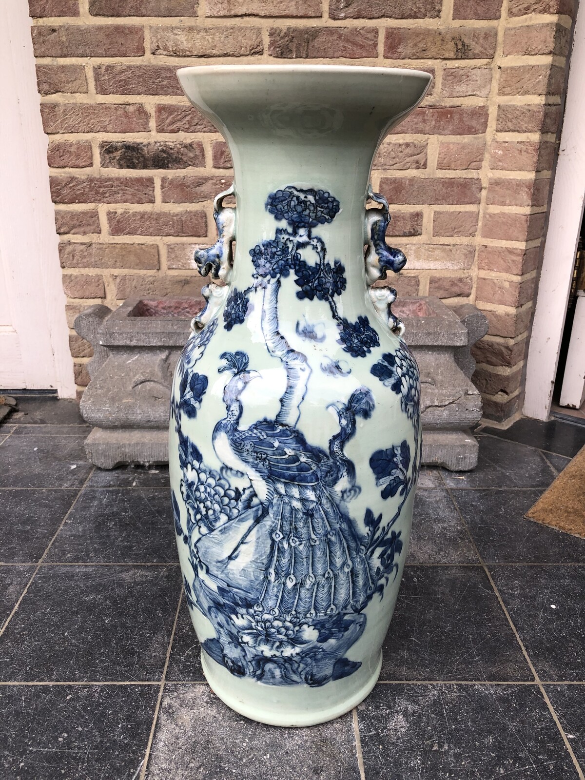 Chinese celadon vase with a peacock