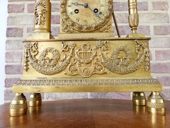 Empire style Clock pendule  in gilt bronze, France 1820