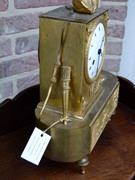 Empire style Gilded clock pendule with butterfly and child in bronze, France 1815