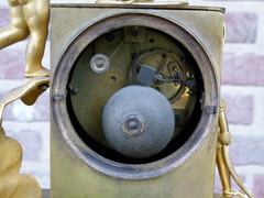 Empire style Gilded clock pendule with butterfly and child in bronze, France 1815