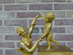 Empire style Miniature pendule clock with a lady and child in gilded bronze, France 1815