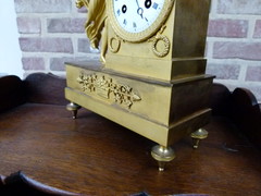 Empire style Miniature pendule clock with a lady and child in gilded bronze, France 1815