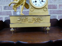 Empire style Miniature pendule clock with a lady and child in gilded bronze, France 1815