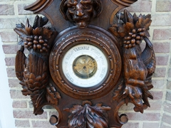 Hunting style Barometer with animals and fruits in carved oak, France 1890