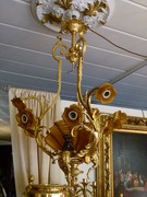 Louis 15 style Lamp with 3 putti,s and brown glass shapes in gilded and patinated bronze, Belgium 1920