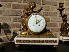 Louis 16 style Clockset with cherub in gilded bronze and white marblee, France 1890