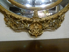 Napoleon III style Huge gilded oval mirror with putto,s, France 1880