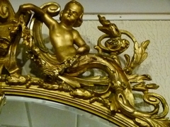 Napoleon III style Huge gilded oval mirror with putto,s, France 1880