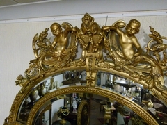 Napoleon III style Huge gilded oval mirror with putto,s, France 1880