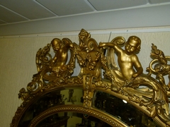 Napoleon III style Huge gilded oval mirror with putto,s, France 1880