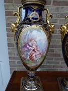 Napoleon III style Pair Sévres vases with romantic scenes by Jules Tiélés à Paris in faience, France 1880