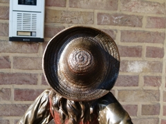 Napoleon III style Scculpture by Maubach of a farmer lady in multi patinated bronze on griot marble base, France 1880