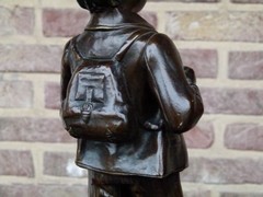 Napoleon III style Sculpture of a pipe smoking boy signed by Melane in patinated bronze, France 1880