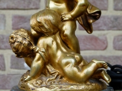 Napoleon III style Table lamp with 3 cherubs-putto,s in gilded bronze on marble base, France 1890