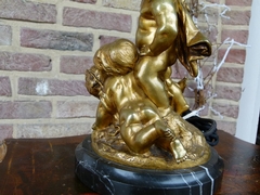 Napoleon III style Table lamp with 3 cherubs-putto,s in gilded bronze on marble base, France 1890