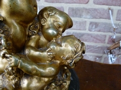 Napoleon III style Table lamp with 3 cherubs-putto,s in gilded bronze on marble base, France 1890