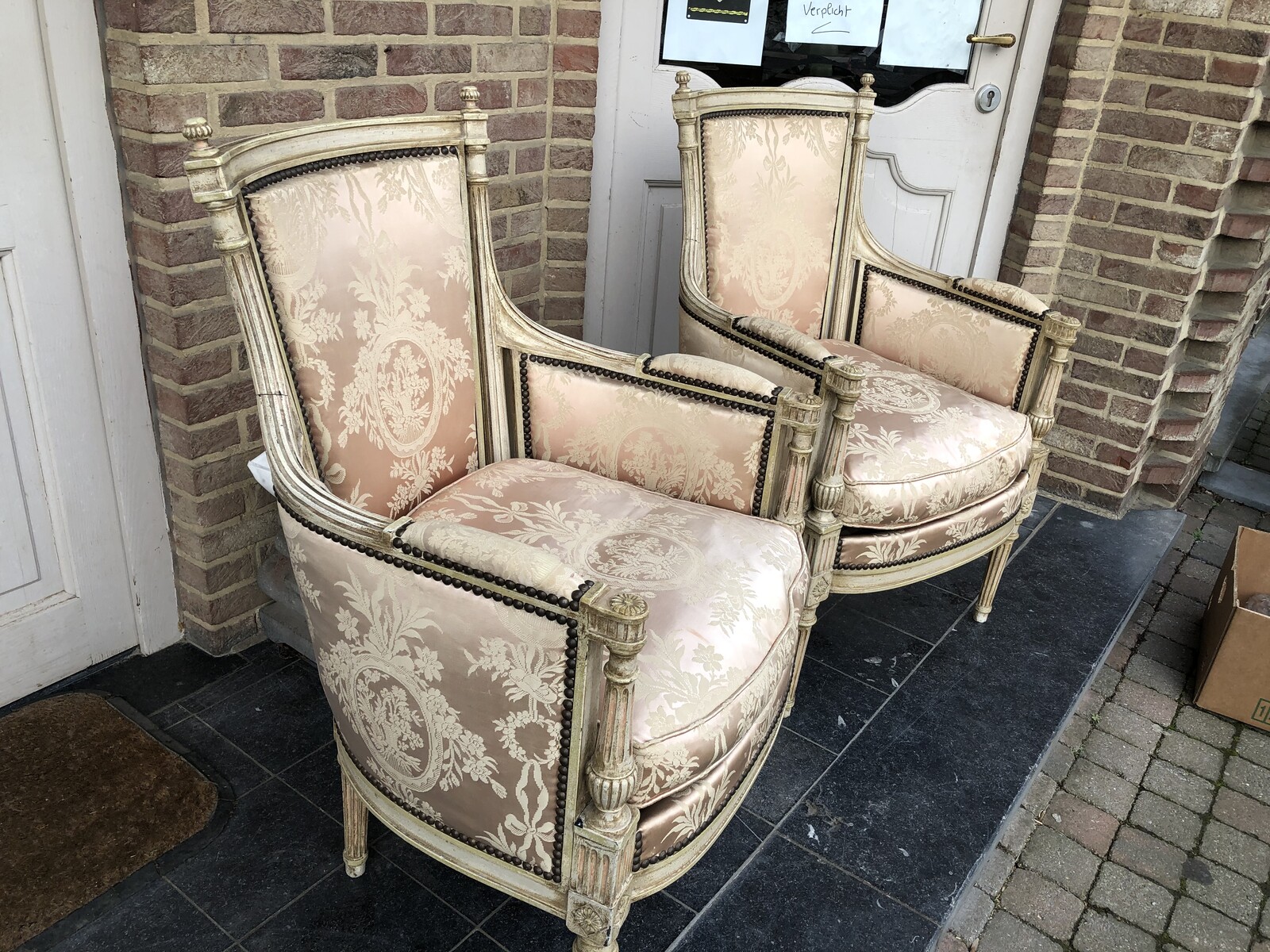 pair patinated armchairs