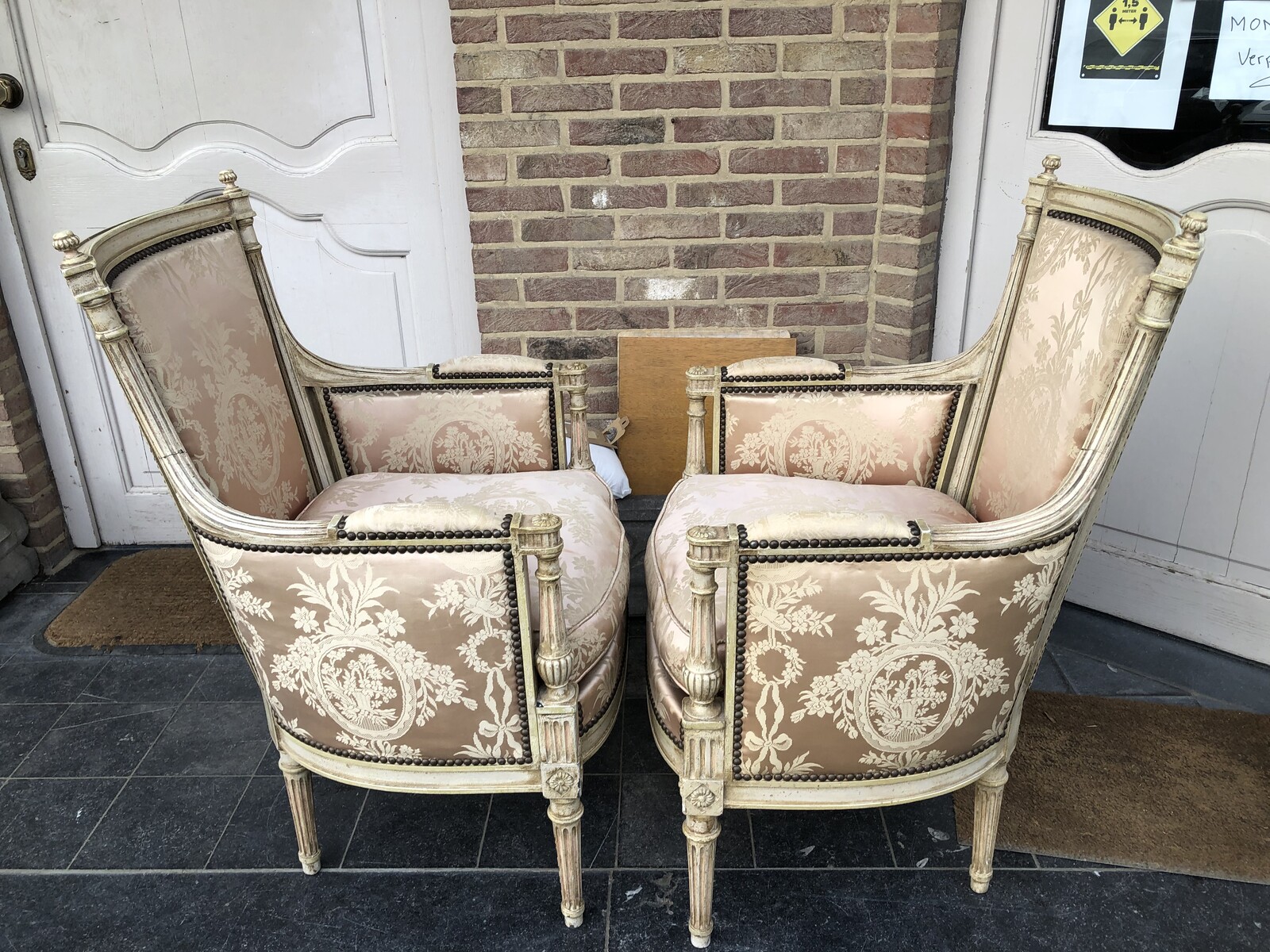 pair patinated armchairs