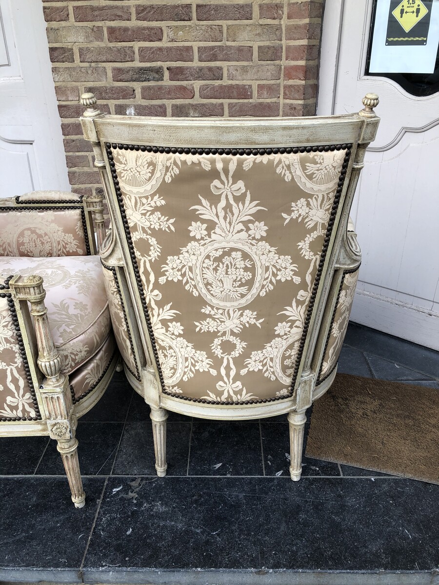 pair patinated armchairs