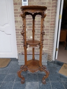 Roccoco style Pedestal stand with heads and flowers in carved walnut, Italy 1900