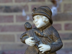 style Sculpture by G.Omert child with doll in gilded bronze and ivory, France 1890