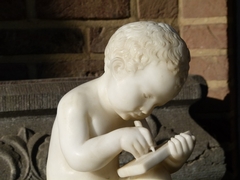 style Sculpture of a young boy write a book in carved alabaster, Italy 1900