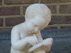 style Sculpture of a young boy write a book in carved alabaster, Italy 1900