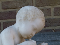 style Sculpture of a young boy write a book in carved alabaster, Italy 1900