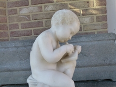 style Sculpture of a young boy write a book in carved alabaster, Italy 1900