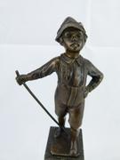 style Sculpture of a young smoking boy in bronze on marble base, France 1920