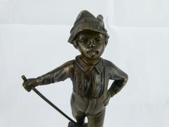 style Sculpture of a young smoking boy in bronze on marble base, France 1920