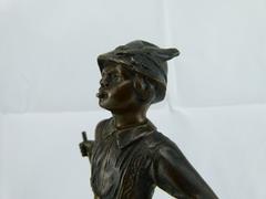 style Sculpture of a young smoking boy in bronze on marble base, France 1920