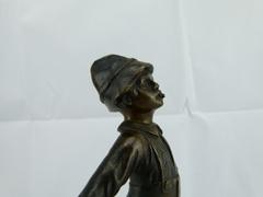 style Sculpture of a young smoking boy in bronze on marble base, France 1920