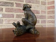 Signed with a V.1902 style Miniature bronze sculpture of a monkey in patinated bronze 1900