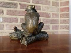 Signed with a V.1902 style Miniature bronze sculpture of a monkey in patinated bronze 1900